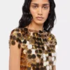 Top dorado con discos brillantes Top dorado con discos brillantes